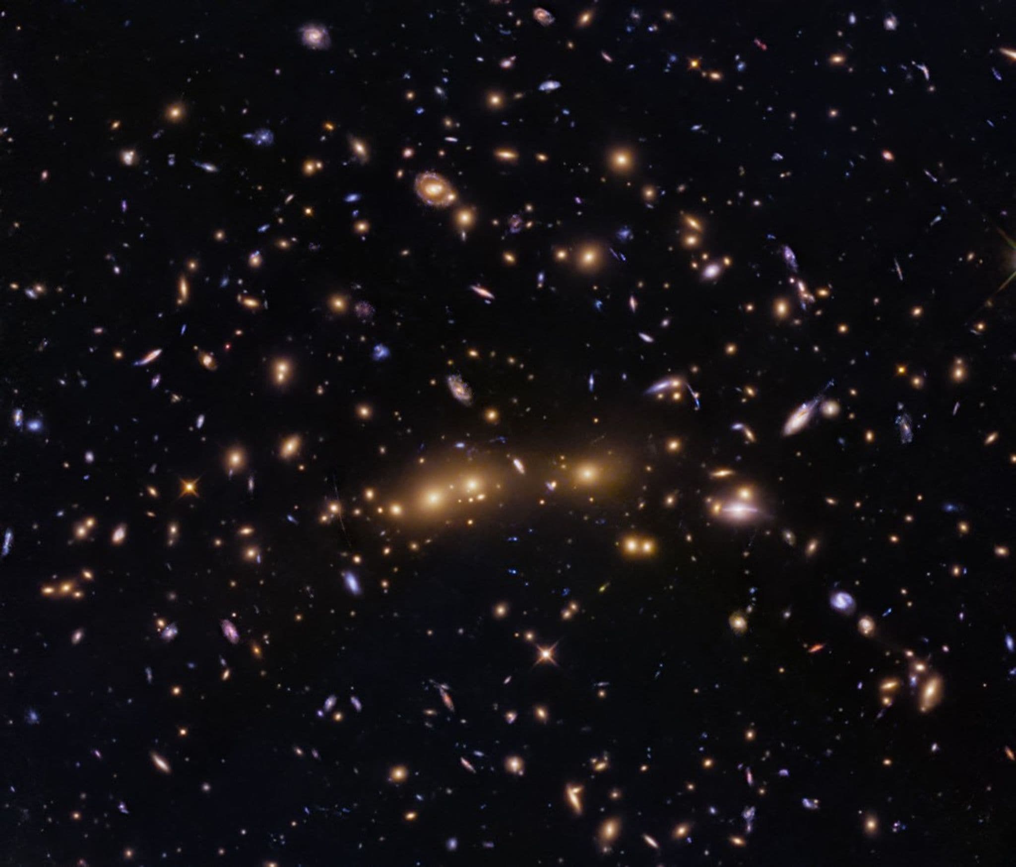 Hubble Space Telescope Captures Spectacular Galaxy Cluster Merger 1