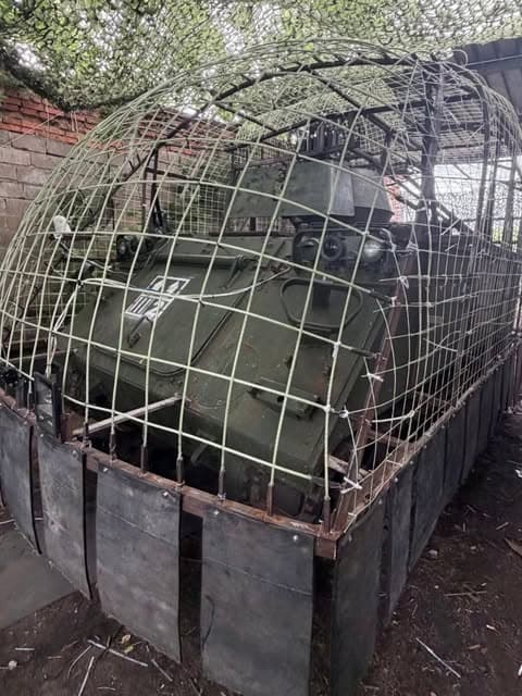 Ukrainian M113 Armored Vehicles Fitted with Anti-Drone Cages and Rubber-Fabric Mats 1